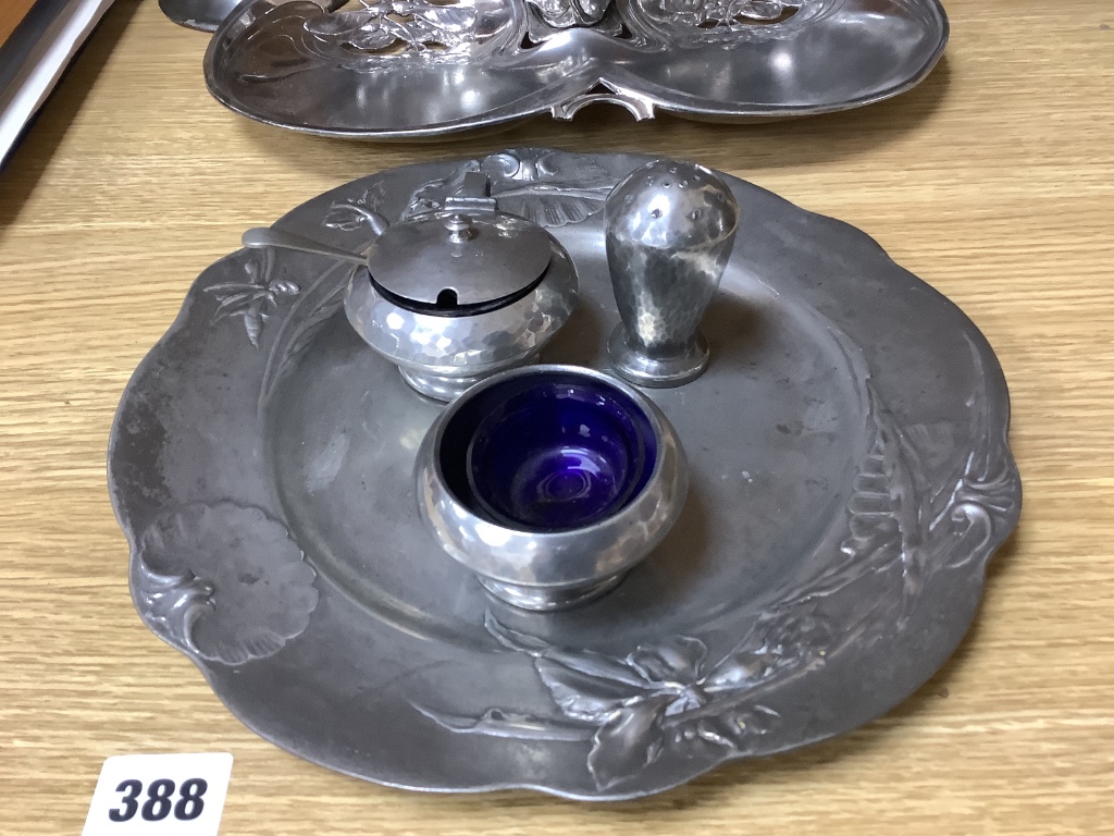 Tudric pewter wares - a Rose Bowl, a comport, a jar and cover, a vase and a three-piece cruet set and other Arts and Crafts and Art Nouveau pewter wares